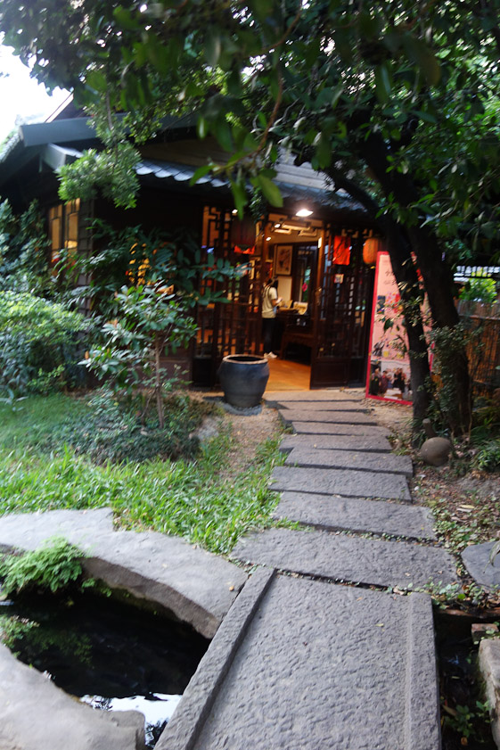 Our second tea house was Wu Wei Tsao Tang. The approach was along a stone path over a little stream, a stark contrast to the hectic urban scene outside its gate.