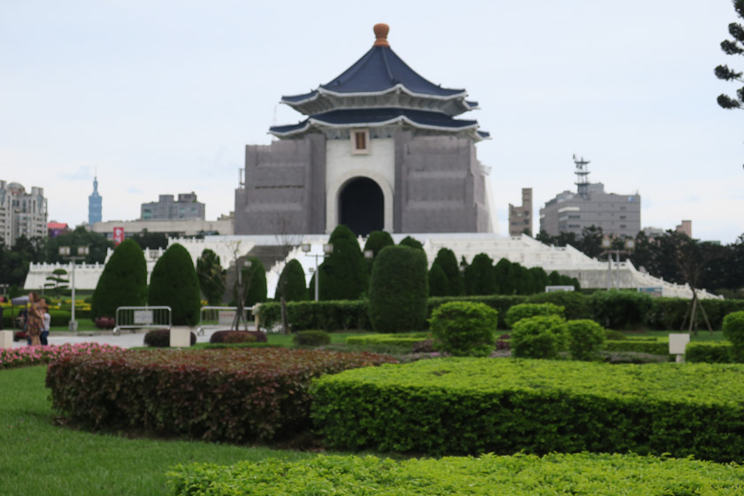The Chiang Kai-Shek Memorial is drab compared to the Theater and Concert Hall, but that gray stuff is shrouding in place during cleaning of the stark white cladding.
