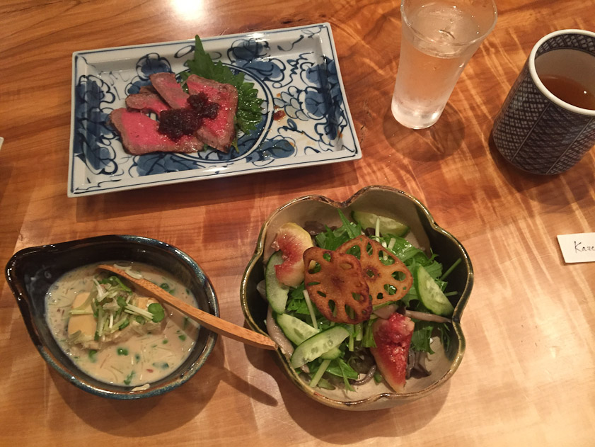 A typically tasty and healthy meal at Omen, a soba restaurant in our neighborhood in Kyoto. The soba course came later. We ate at a large beautiful slab of wood with three other couples.