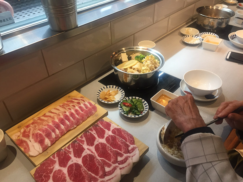 We ate twice at a hot pot restaurant near our hotel called Mr. Meat. The meat is cooked briefly in the stock with vegetables, dipped in egg and seasonings, and eaten.
