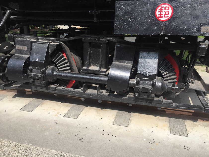 Bevel gears on the driveshaft (hidden by shields) engage crown gears on the front wheels.