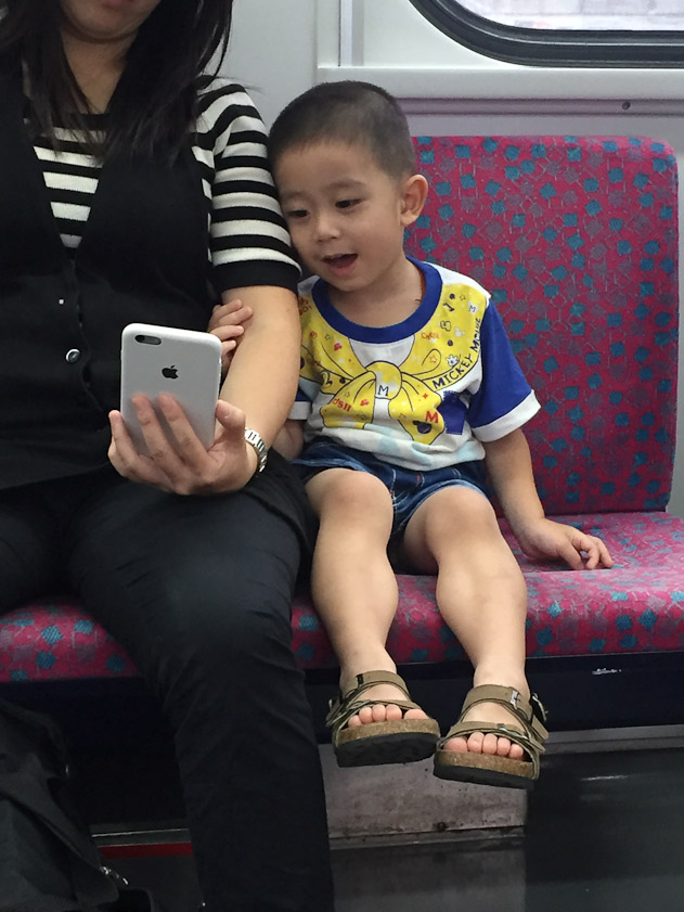 Mom entertained her son on the train bck to Taichung.