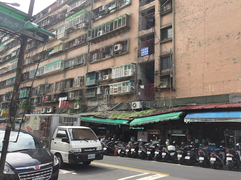 Windows protected by grills up to the top floor. Everything ratter higgrly-piggly..