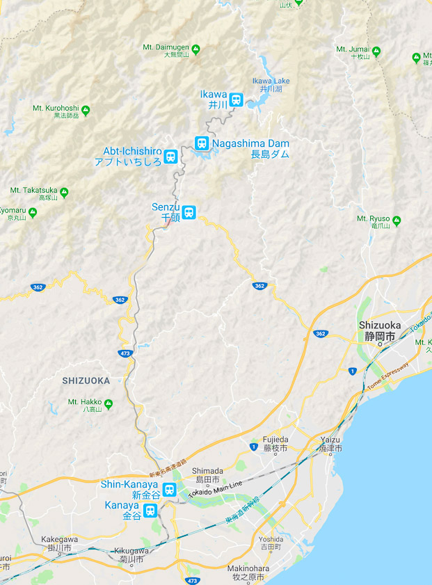 The Oigawa Railway runs from Shin-Kanaya to Ikawa, with a change at Senzu. The stretch from Shin-Kanaya to Senzu is called the Main Line. The stretch above Senzu is the Ikawa Line and has tighter curves, shorter cars, and a 1.5 km segment with 9% grade below the Nagashima dam that uses an Abt locomotive.