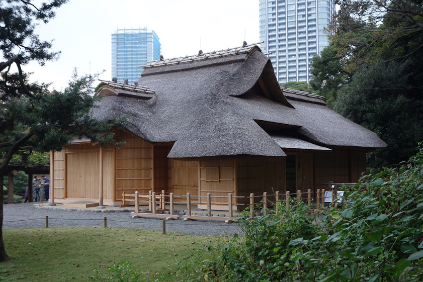 A tea house with a thatched roof.