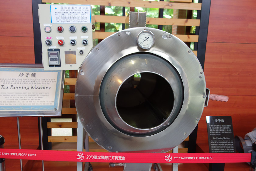 At some point the tea can be heated (panned) to stop the fermentation by denaturing the enzyme. This machine is one way to do this.