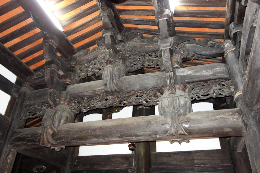 The carving in the beams supporting the roof over the front part of the house is exemplary.