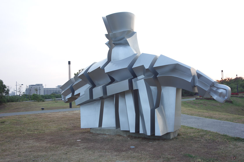 Striking sculpture between the museum and the southern entrance. It looks to me to have a head, arms and a torso.