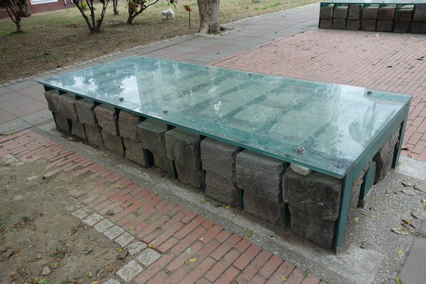There was no label to explain these eight neat piles of stones protected with glass covers just east of Great South Gate.