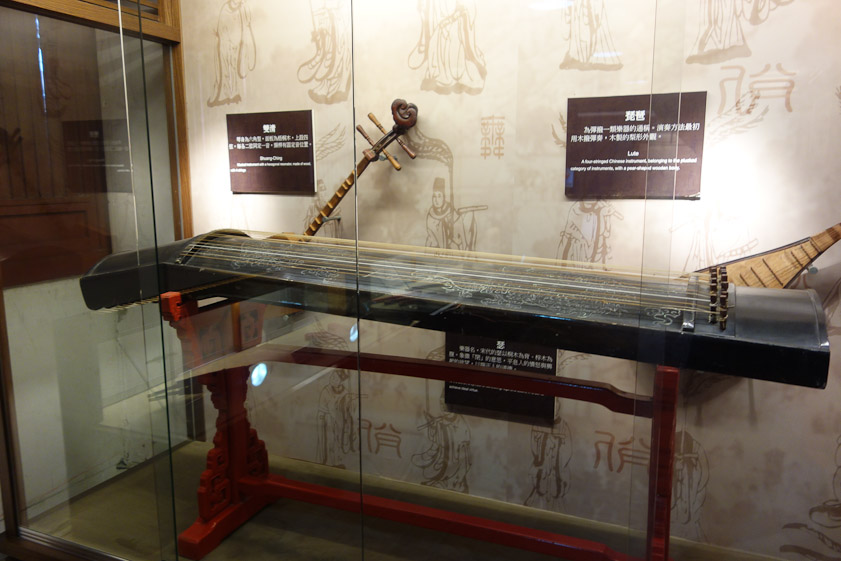 A se, predecessor to the guzheng which we saw played at our hotel. This se has tuning pegs on the right and bridges going straight across the sounding board. The guzheng has one straight and one diagonal brige.