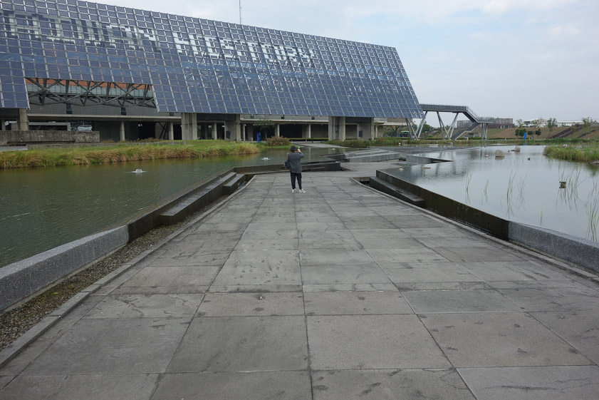 We didn't sightsee on the 28th, and stayed in the room most of the day as Mariana felt bad. The next day we visited the National Museum of Taiwan History. The entrance is a walk that dips below the level of the surrounding lake. That is a large solar panel array.