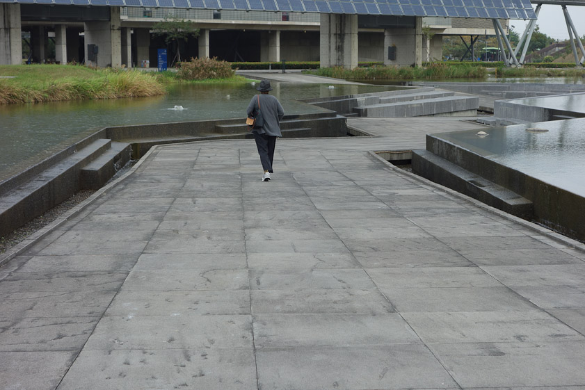 Water spills into gutters for recirculation via a fountain.