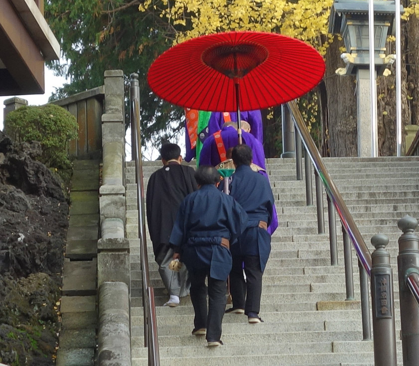 On our way out we passed a stately procession going to a ceremony somewhere. No elevators for these officials!