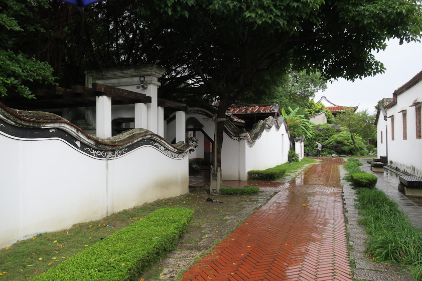 The compund wall along the back of the main house.