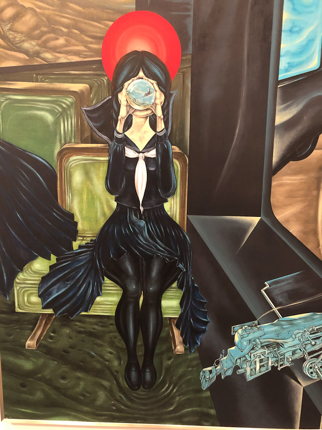 The schoolgirl facing you is looking into a crystal ball.