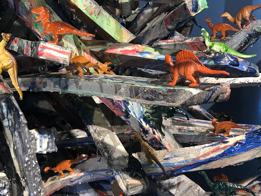 The label has something to say about man's effect on the environmnet, so these dianosaurs refer to extinction.