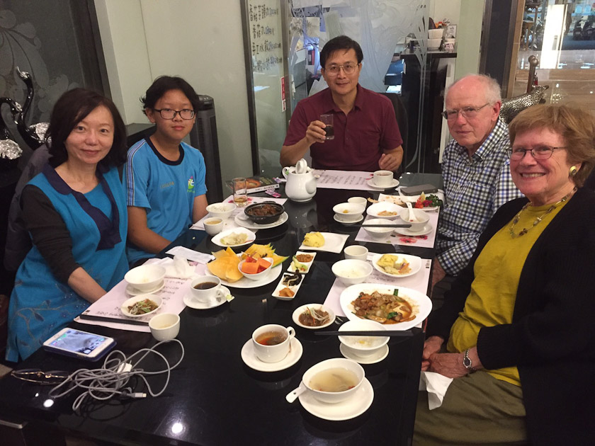 Ally's husband is at the end of the table.