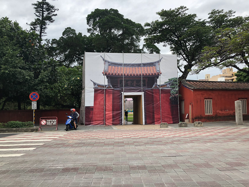 The gate to Confucius Termple is being renovated behind this painted version.