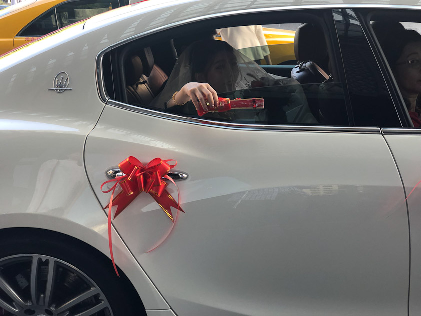 We were checking out of our hotel in Tainan as a wedding party was departing. We learned that the bride was was going to drop something out the window containing all the bad luck she would leave behind her.