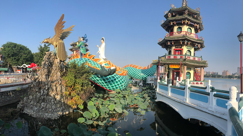 There are three human figures and an eagle on the dragon.