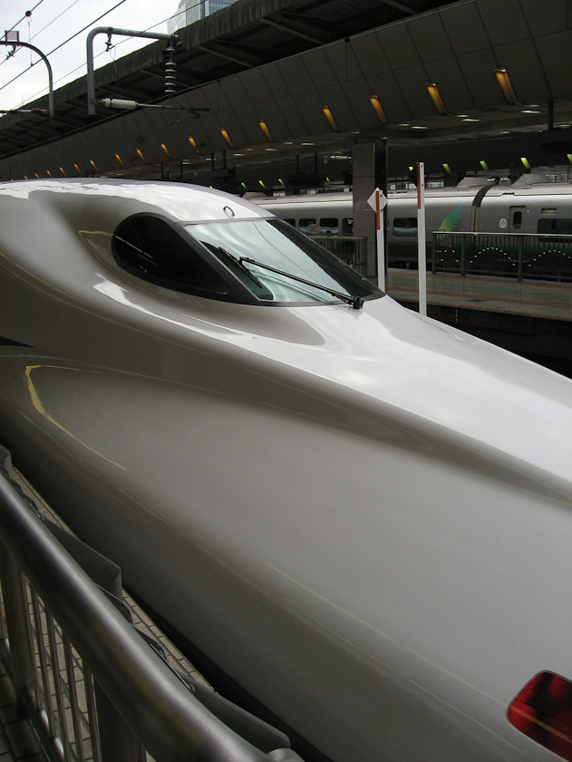 Shinkansen engine noses are aerodynamically shaped to reduce air resistance and noise from passing through tunnels. This is one of the latest models, a series 700 or N700.