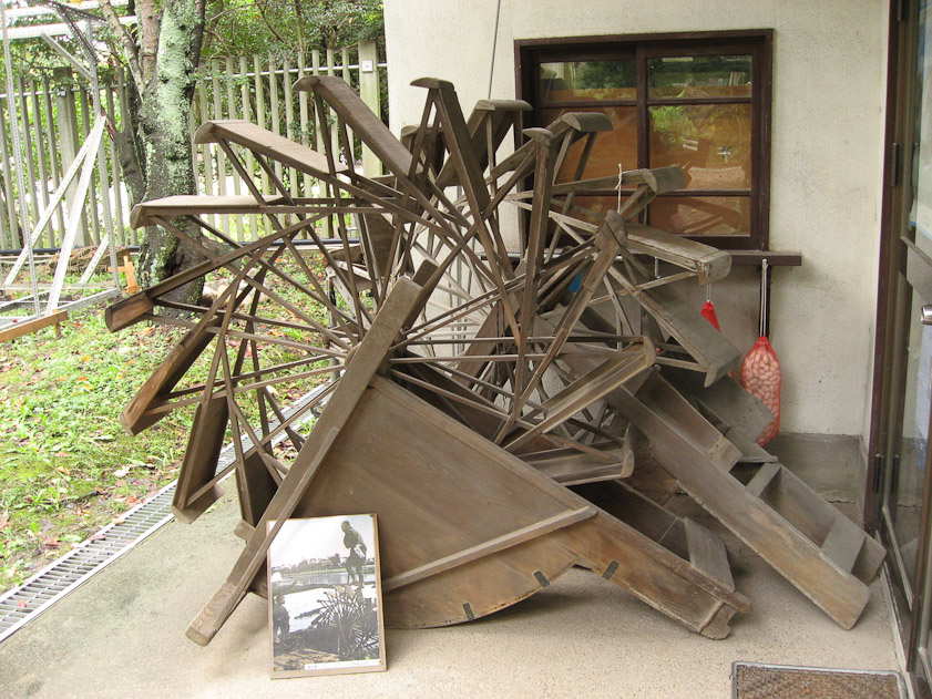 These are man-powered water pumps, as shown in the photo at the bottom.