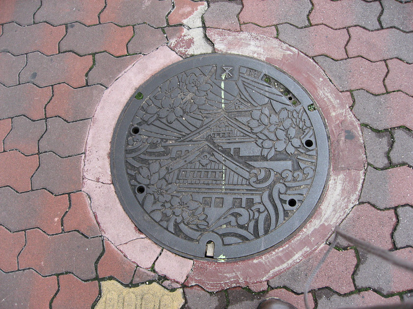 Manhole cover in Osaka. That is Osaka Castle.