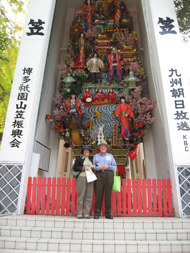 We're standing in front of the garage where a towering float is stored and displayed in between its use in festival parades.
