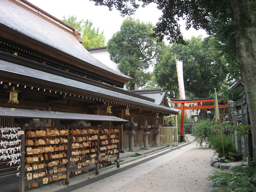 The screws of white paper and the wood plaques at the left hold wishes.