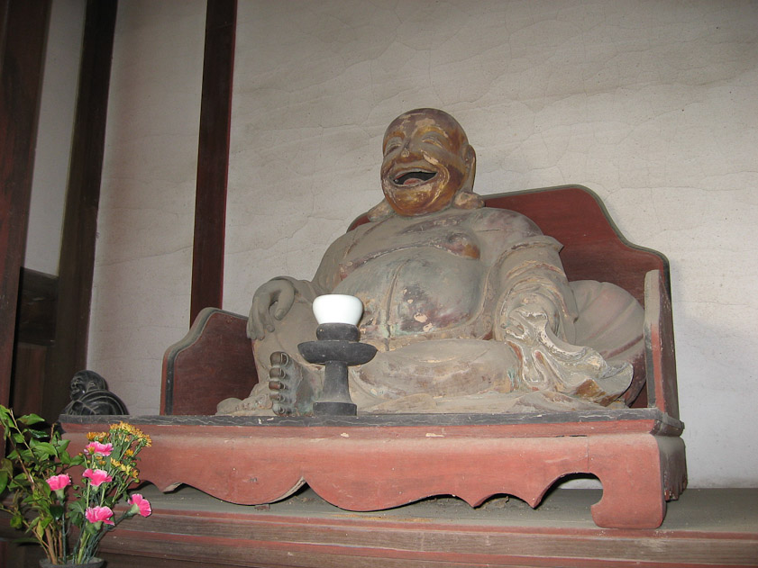 A laughing Buddha at Tenno-Den, constructed in 1705.