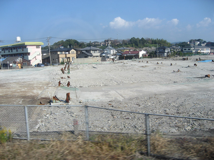 We passed a considerable area of concrete wiped clear of buildings by the bomb blast.