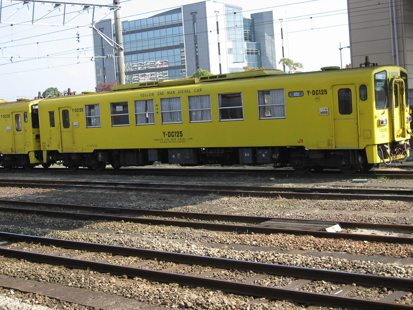 A local train, the Yellow One Man Diesel Car of Kyushu Railways.