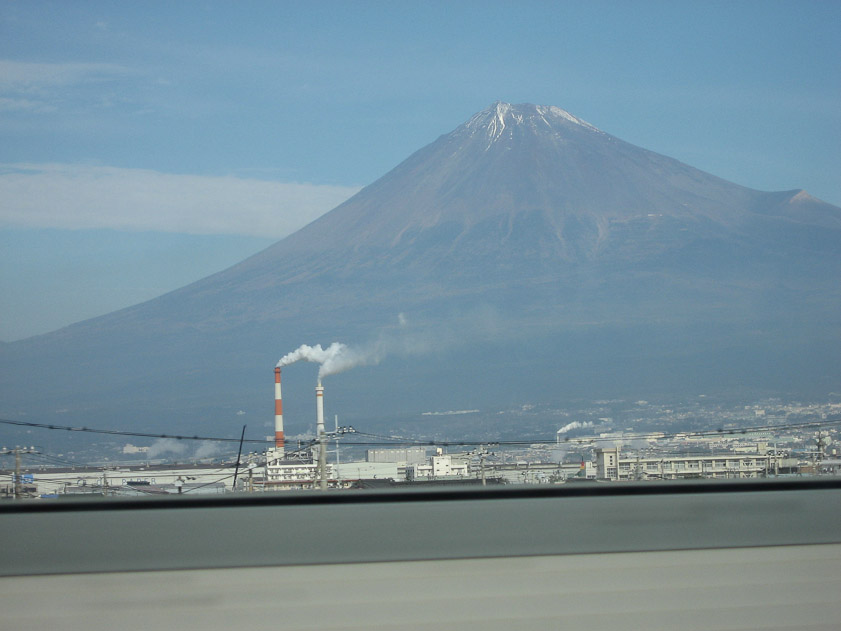 The shinkansen tracks between Nagoya and Tokyo pass Mount Fuji