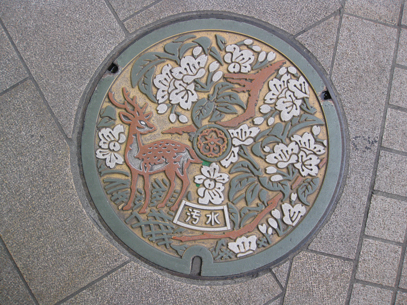 Manhole cover in Nara. Deer are a symbol of Nara, where they wander freely, cadging food from tourists.