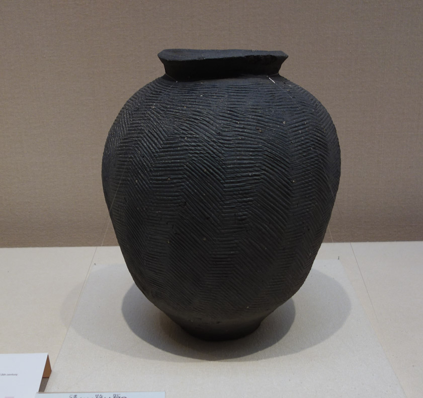 This Suzu ware jar with stamped lines is 13c.