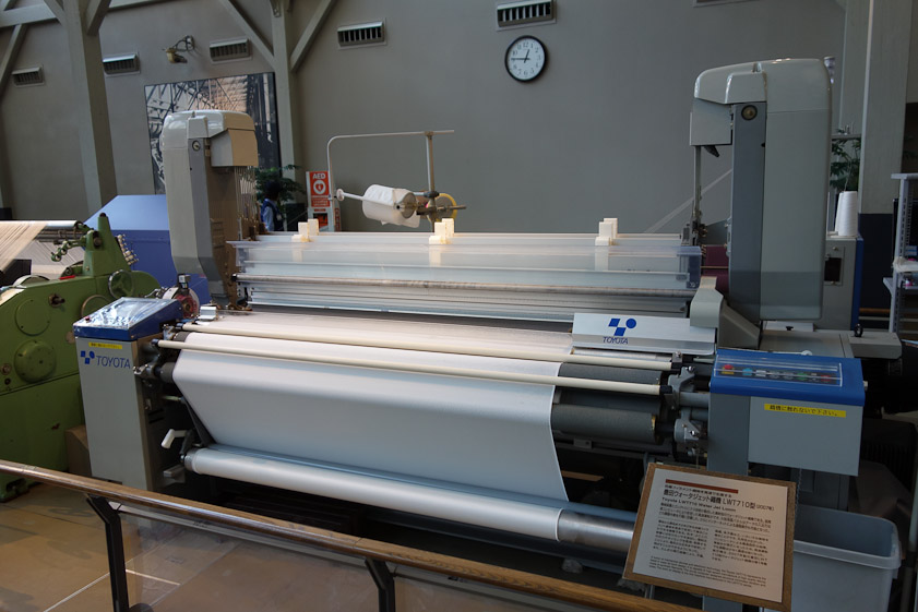 The weft is worked back and forth in this modern loom by a water jet.