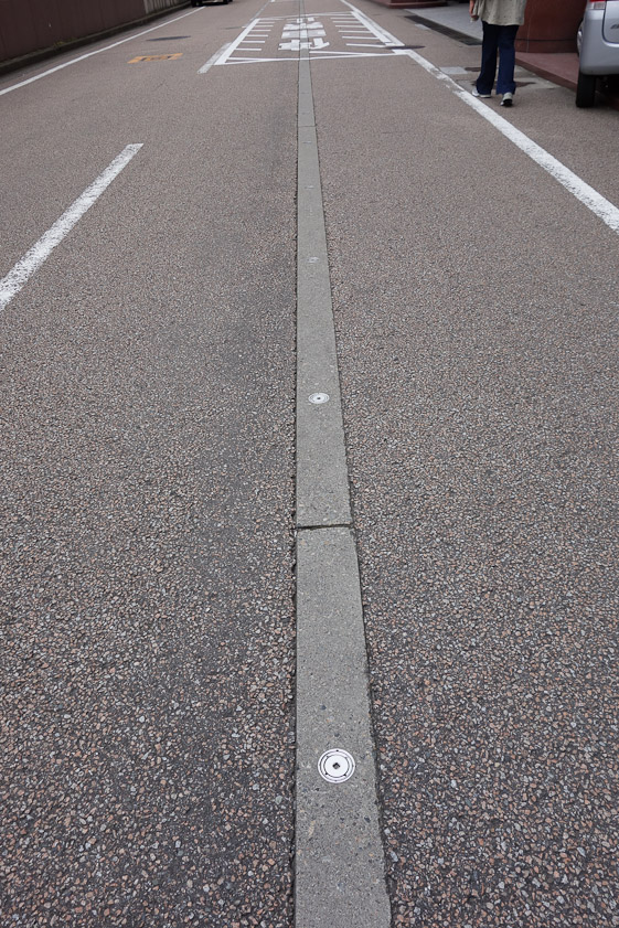 Kanazawa and several other cities that wea visited have many small sprinklers set in the roads to de-ice them in the winter.