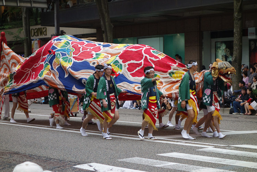 There were several dragons in the parade, swerving to menace people on the curbs.