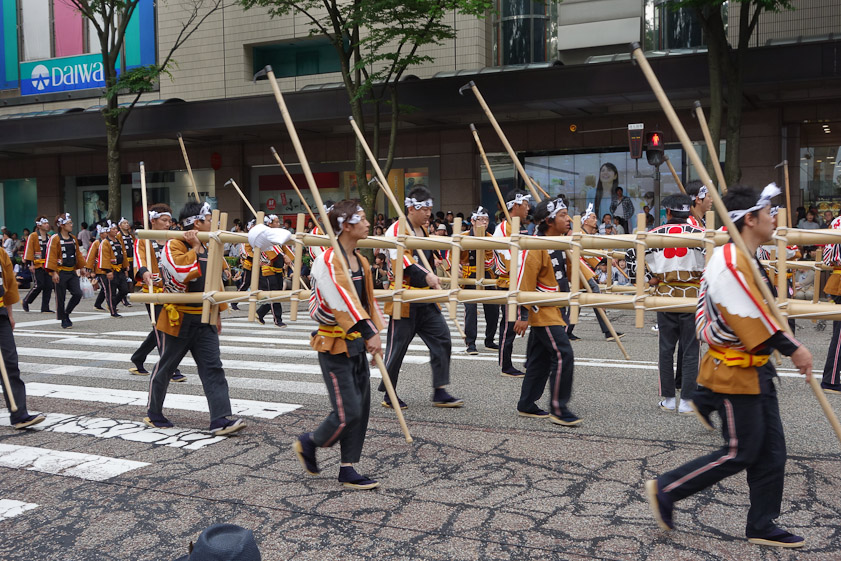 Each company of firemen carried heavy bamboo ladders and pikes with hooks with which to pull buildings down to form fire breaks.