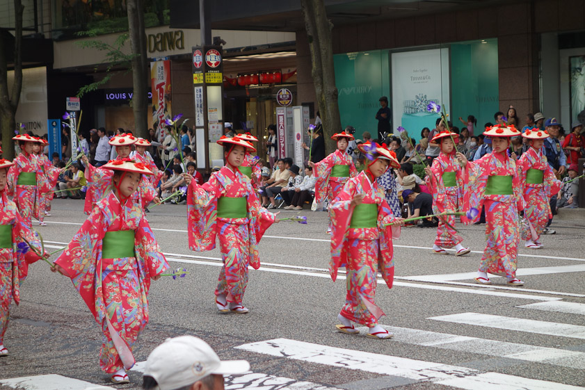 They appear to be holding irises.
