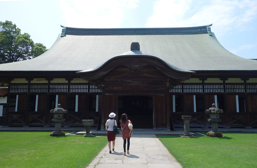The lecture hall is behind the main hall.