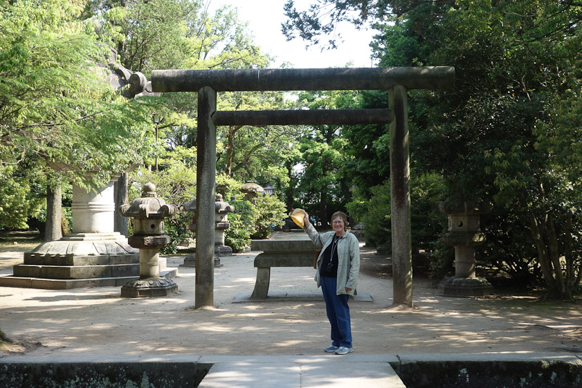 Mariana at the torii marking the entrance to the burial site.