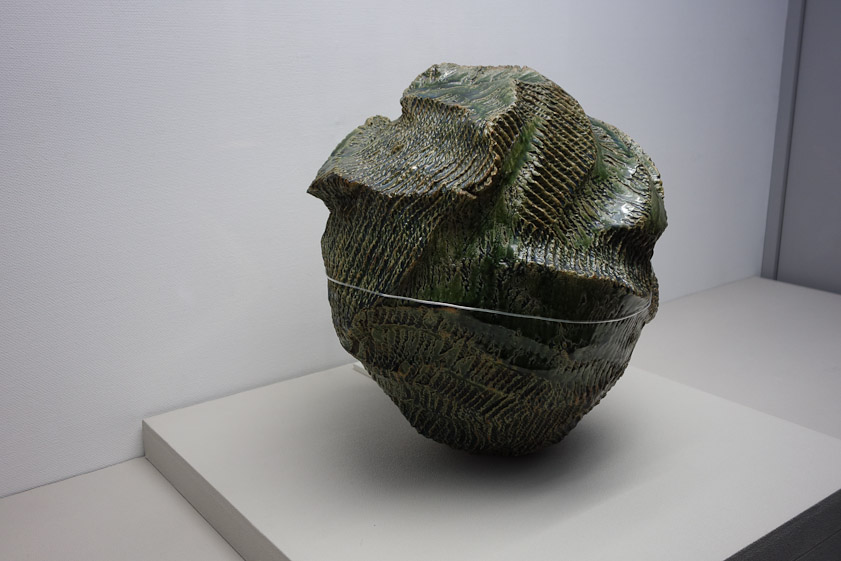 The Mashiko Museum of Ceramic Art had a wonderful show of ceramics by Okabe Mineo (1919-1990). The cord around the middle is a mounting device to hold this piece in case of earthquakes. Okabe used many different celadon glazes, including this dark green type.