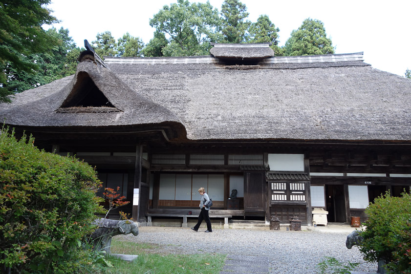 Mariana in front of Hamada's house, which is a traditional farm design.