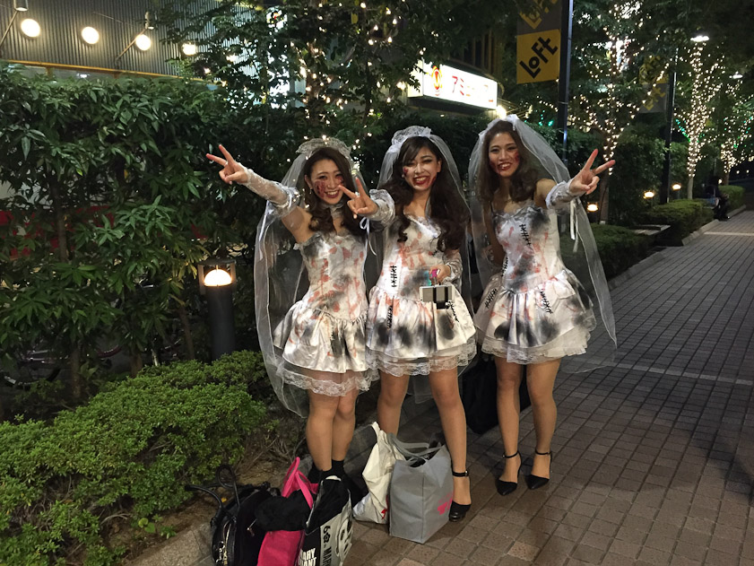 Happy Halloween! Three girls out on the town near our hotel in Osaka. The ghoul in the middle is holding a selfie stick.