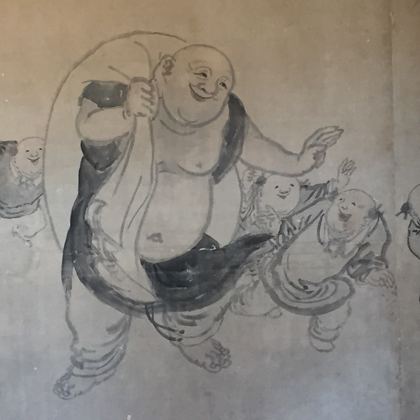 I'd guess he was a god or symbol of wealth or happiness.