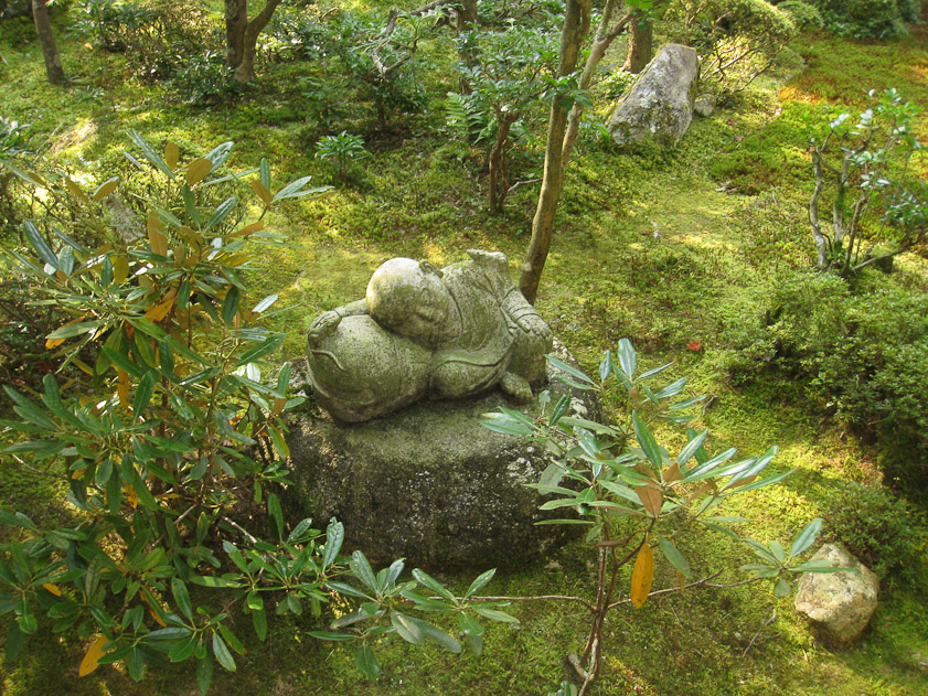 Sculpture of a boy sleeping at Enko-ji. There's a mouse on his left shoulder and another near his right hand.