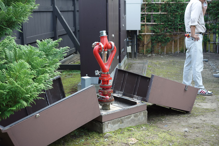 A modern fire cannon to shoot water on the Ito house. Presumably it would be triggered by sensors inside the house, like the sprinklers in a hotel room.