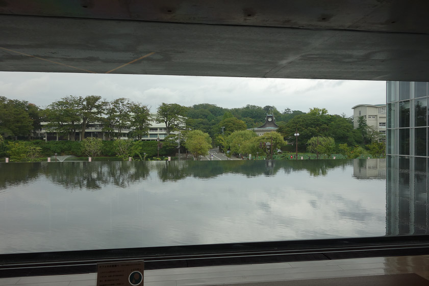 The view from the lobby of the Akita Museum of Art is across a pool of water with no visible wall.