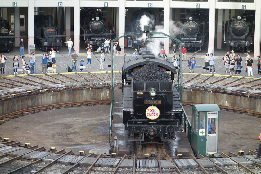 The turntable operator is in the green cab.